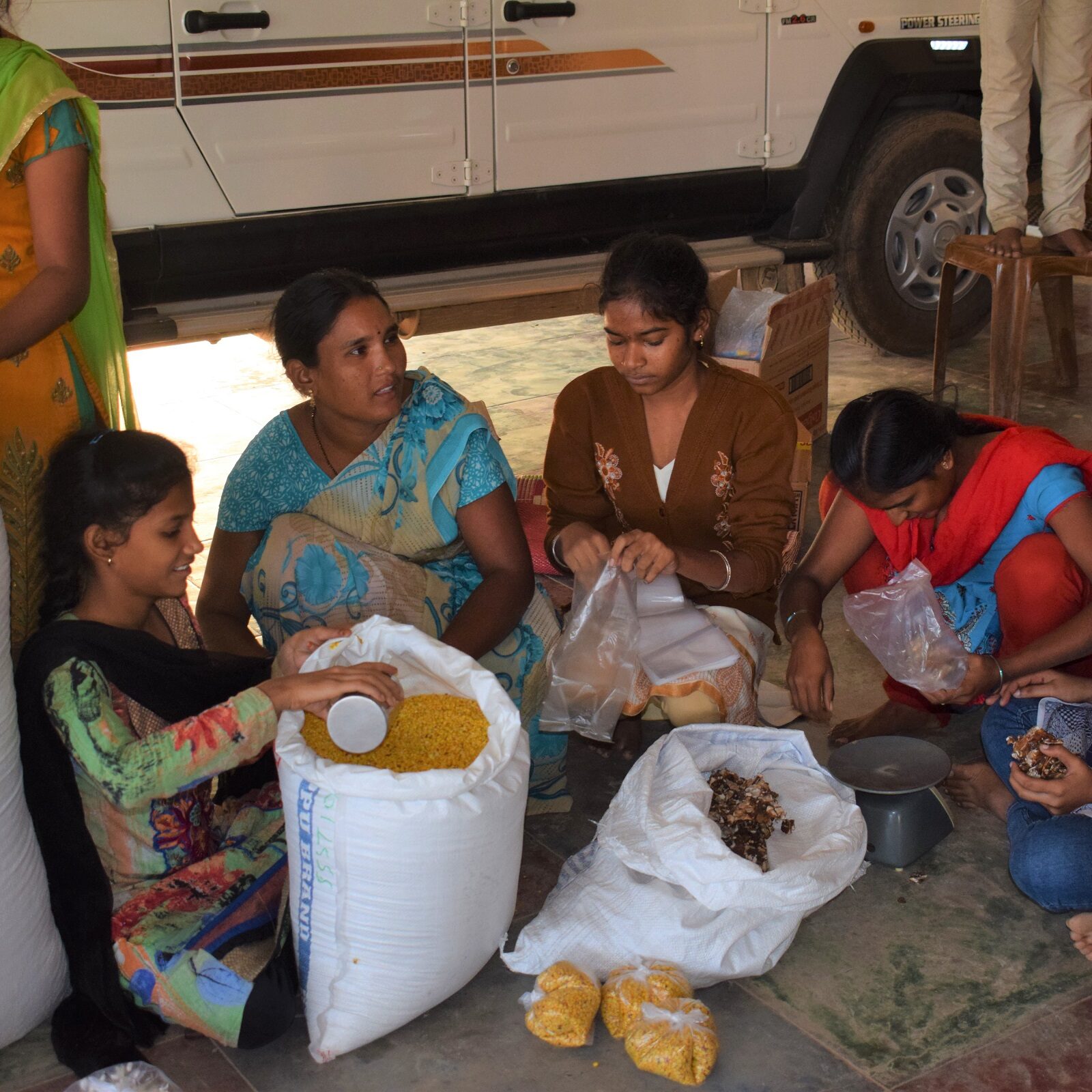 MTF Staff and BBH children packing ration Kits 
